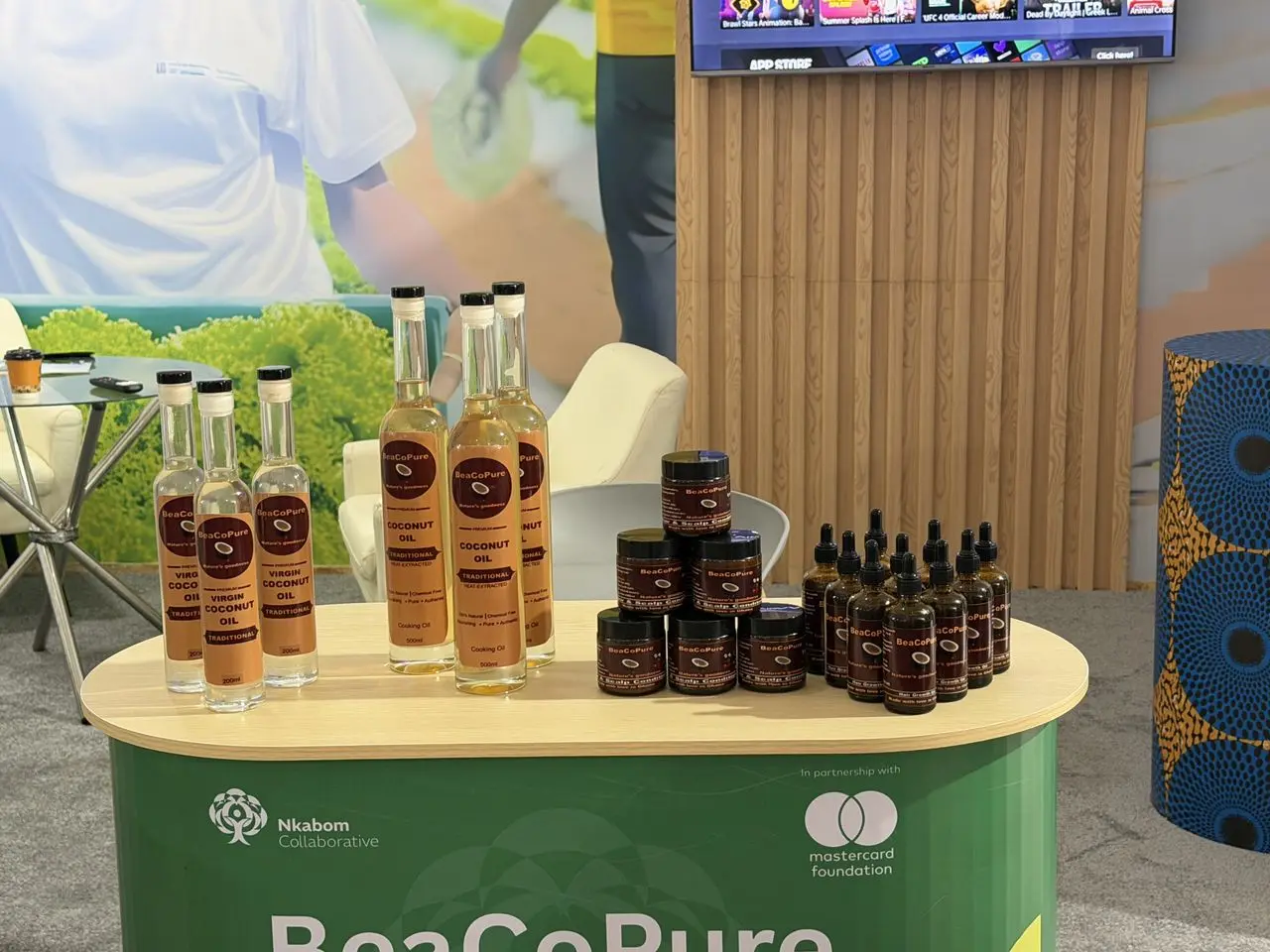 BeaCoPure bottles and jars on an exhibition stand branded for the company.